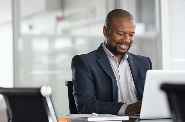 man doing home banking in office